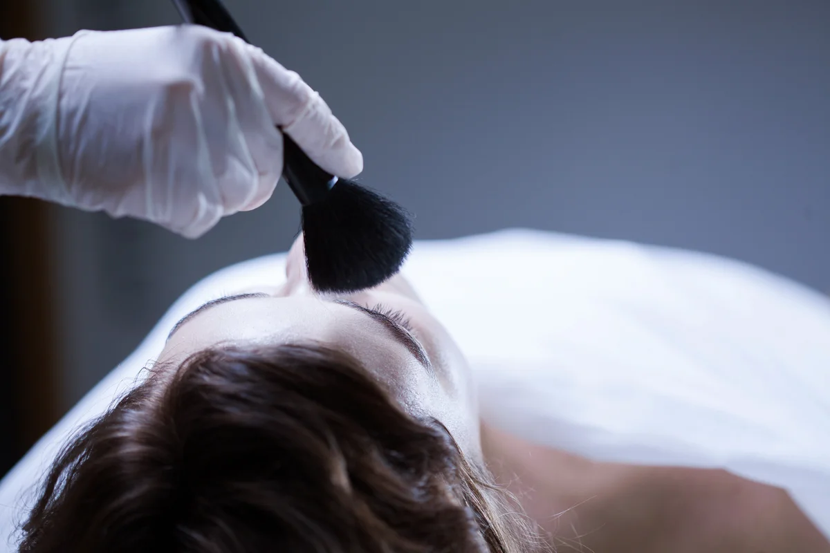 Worker of funeral service making posthumous cosmetics