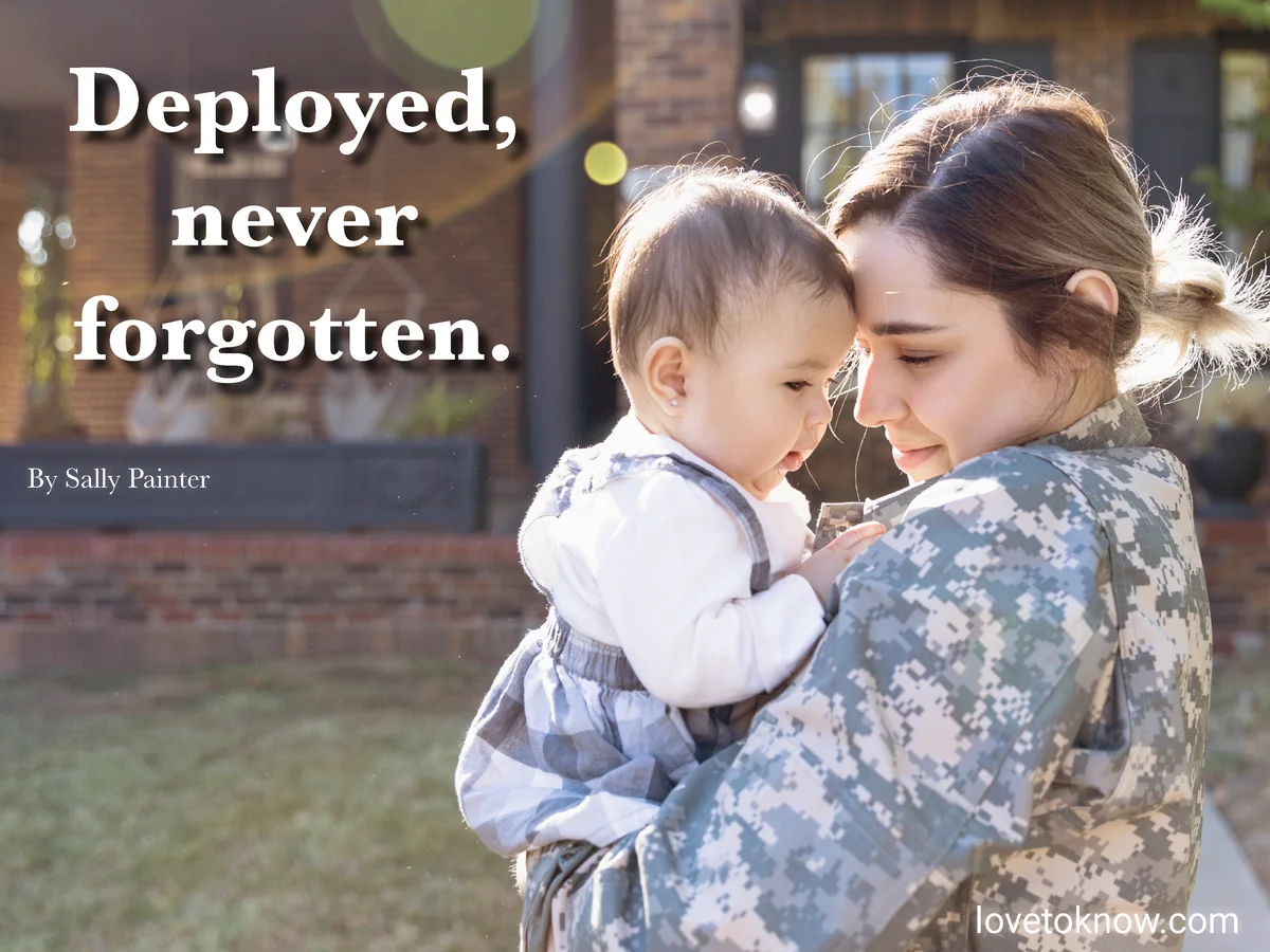 Military woman on deployment holding her baby