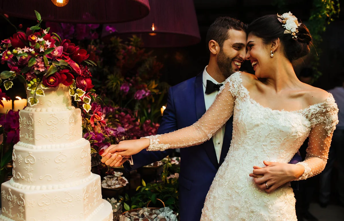 Newlyweds cutting wedding cake