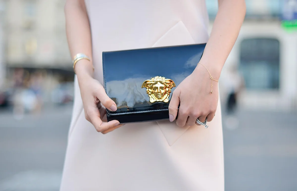 Lynn Samra poses wearing a Balenciaga dress and a Versace clutch | Getty Editorial Use