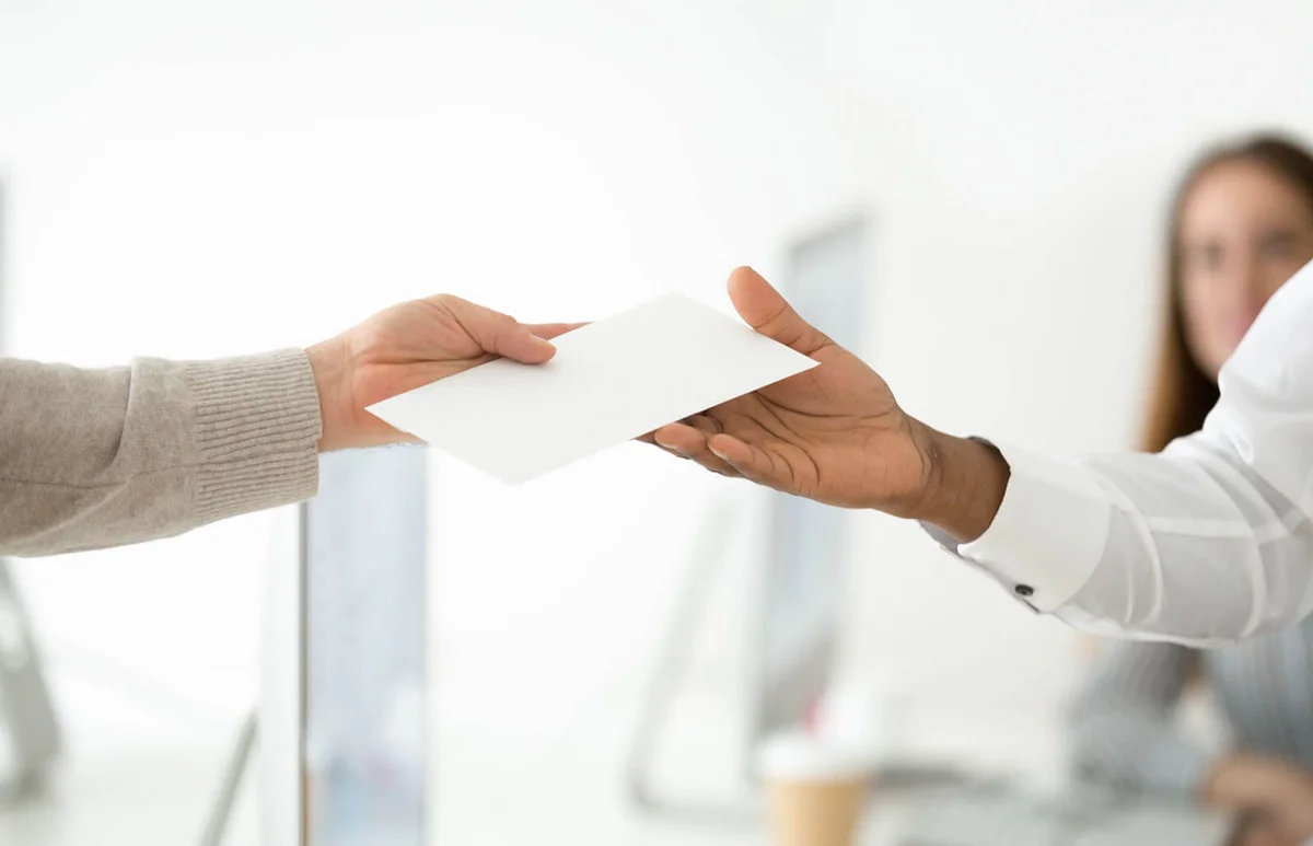 handing another person an envelope