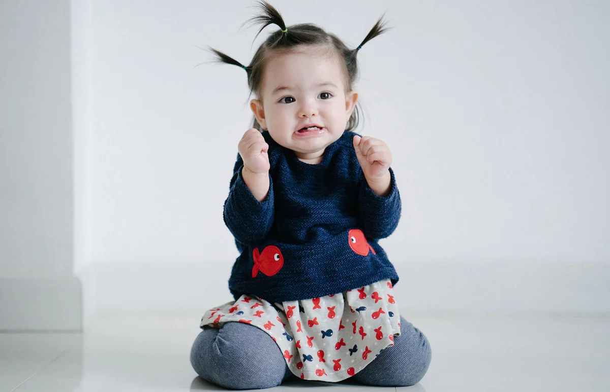 cute toddler girl grimacing