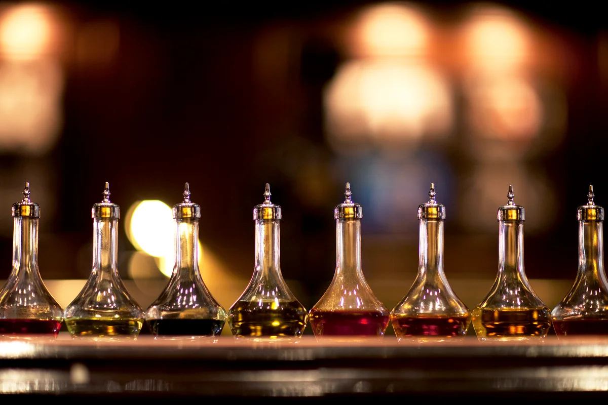 Bitters lined up on a bar