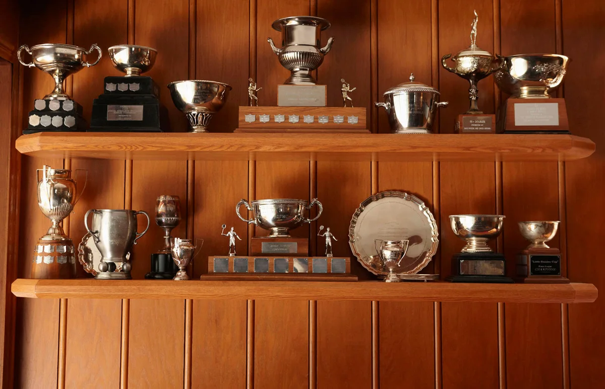 Trophies Lined Up On Display Shelf