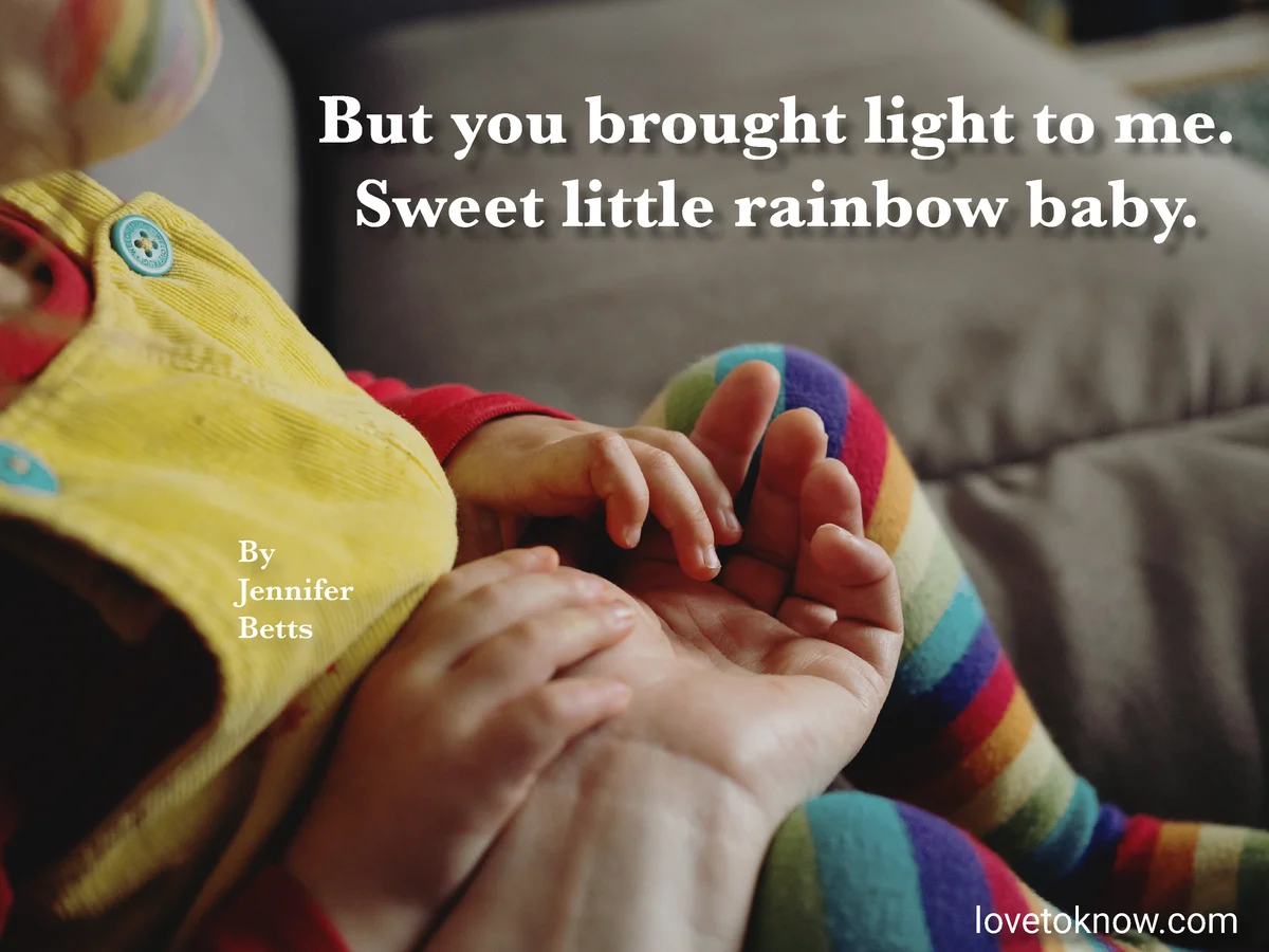 Mom and baby dressed in rainbow and rainbow baby poem