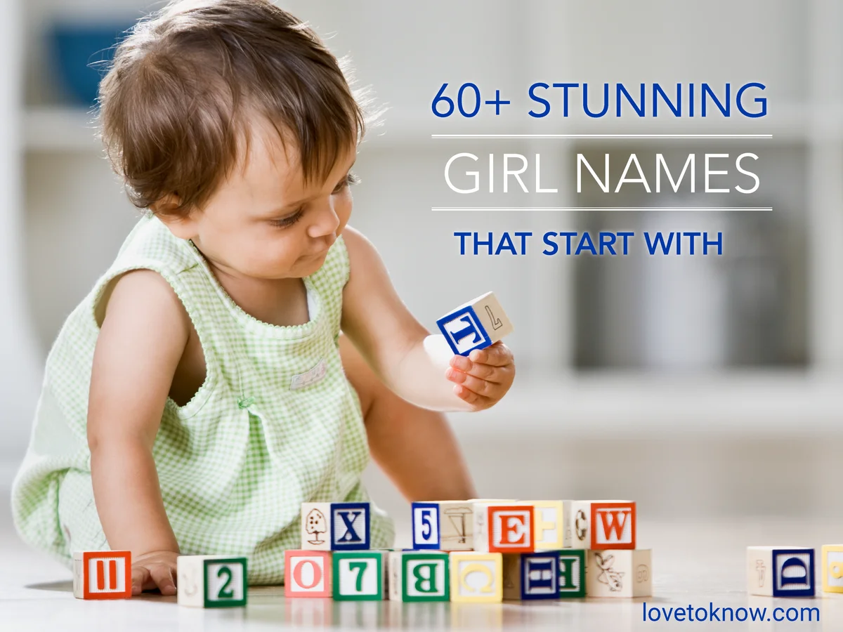 Baby girl playing with blocks and letter T