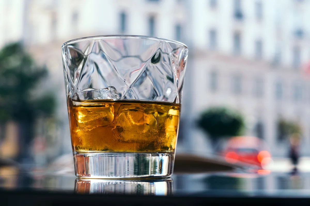 Glass of four horsemen drink on a table outdoors