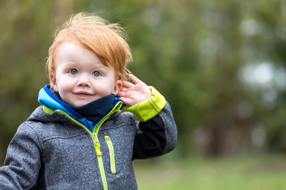 Little Boy Listening to Nature Sounds Outdoors