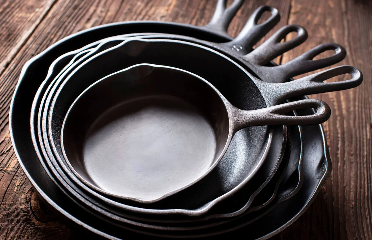 Cast Iron Skillets on Rustic Wood Table