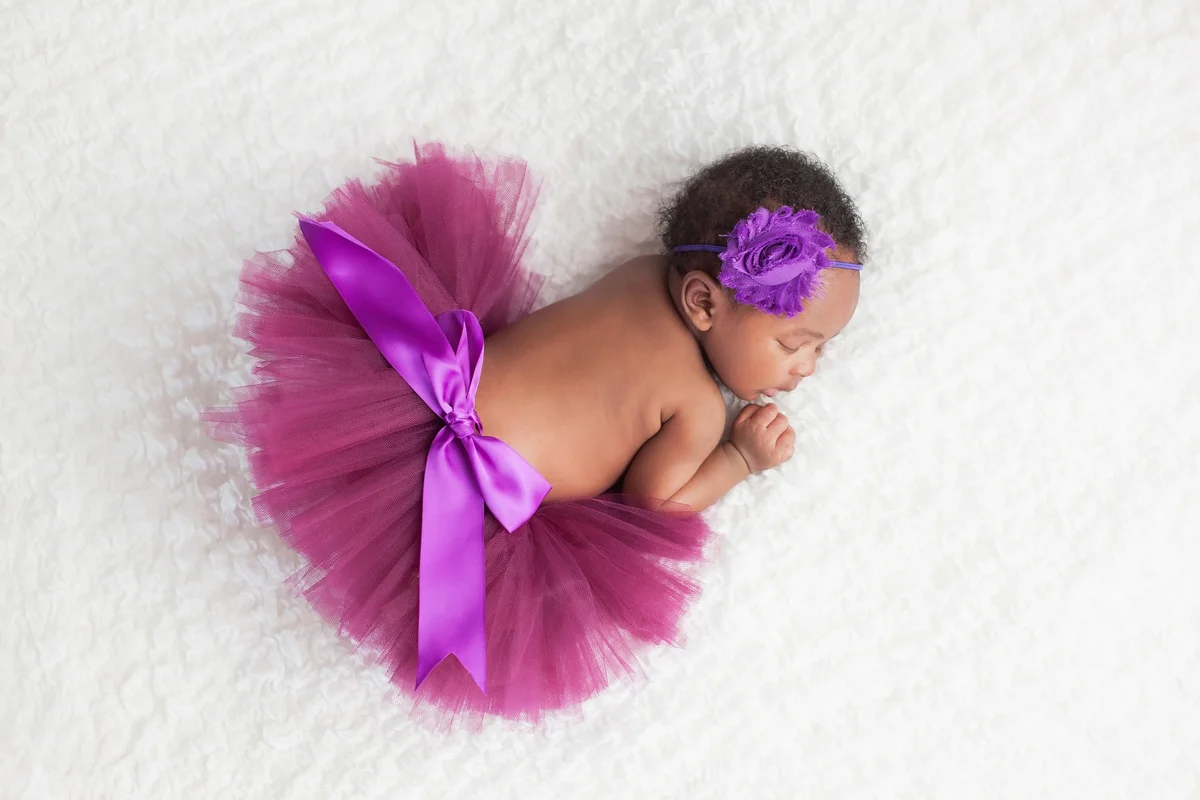 Newborn Baby Girl Wearing a Purple Tutu