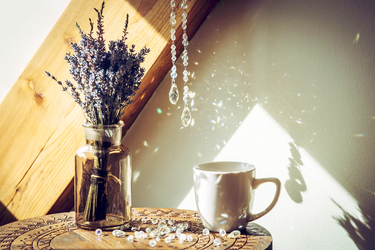 Crystal rainbow maker sun catcher hanging in home