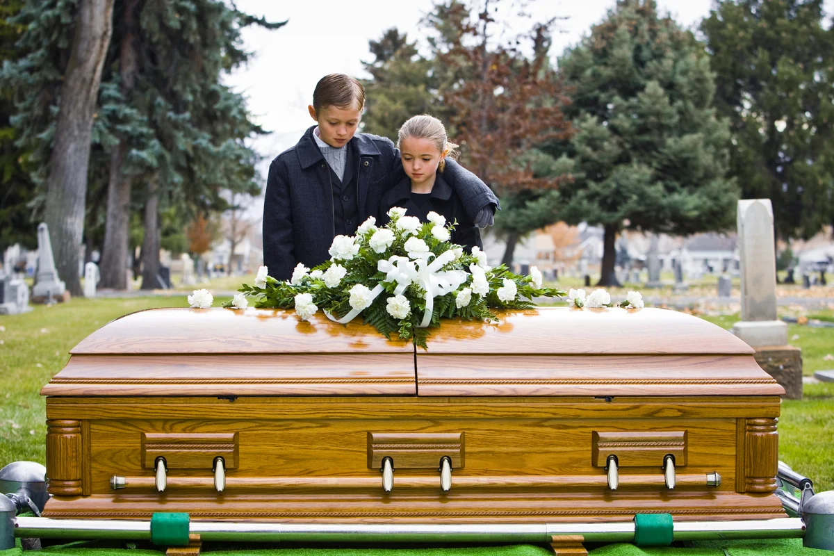 Brother and sister at a funeral
