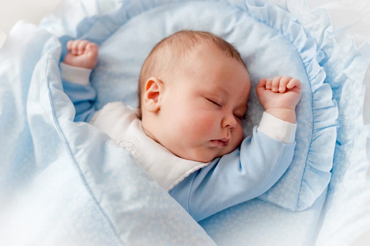 Baby's Restful Sleep Newborn Baby In A Wooden Crib