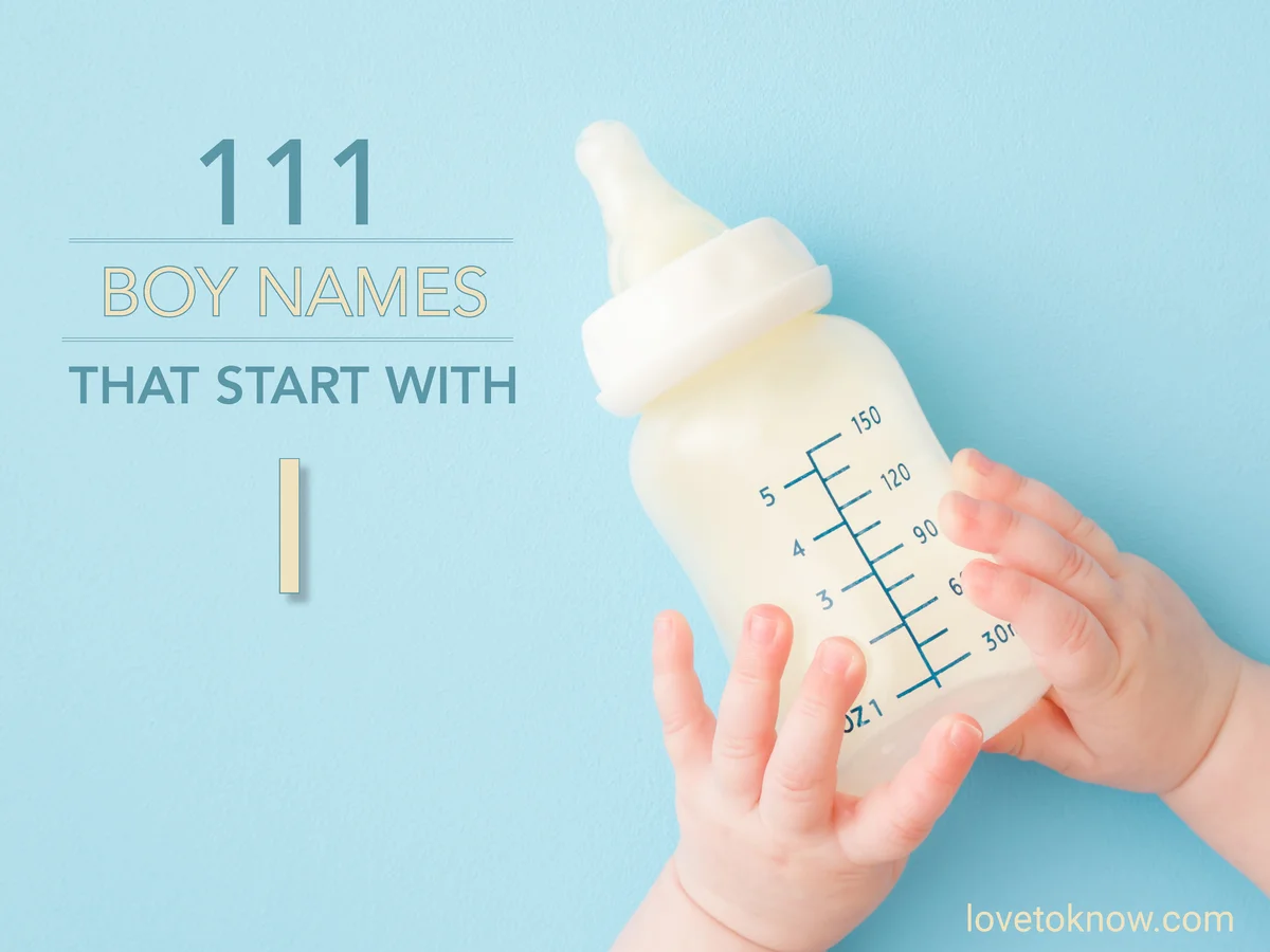 Infant hands holding bottle of milk on light blue floor background
