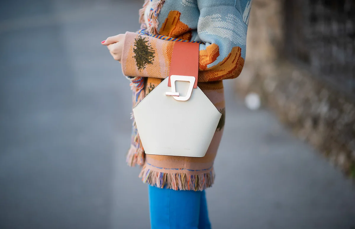 Sonia Lyson is seen wearing bag Danse Lente on Day 3 Milan Fashion Week Autumn/Winter 2019/20 | Getty Editorial Use