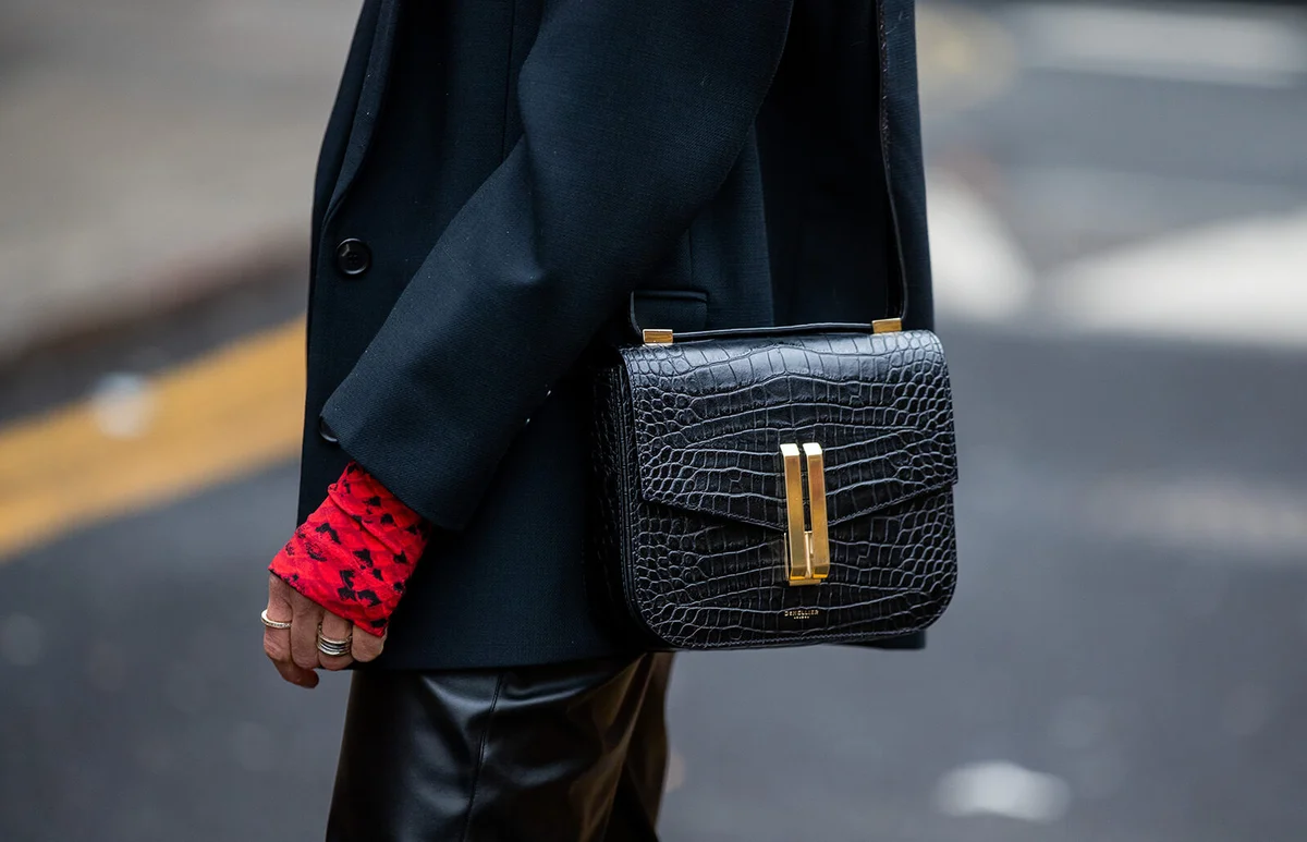 Denise Buschkühle is seen wearing top Preen, Le Apt black pants, &other Stories blazer, Demellier London bag | Getty Editorial Use