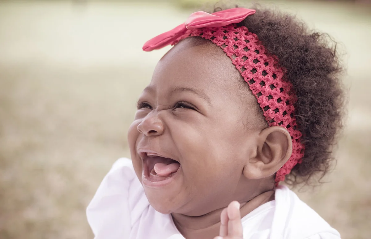 Happy Toddler Girl Wearing Red Headband