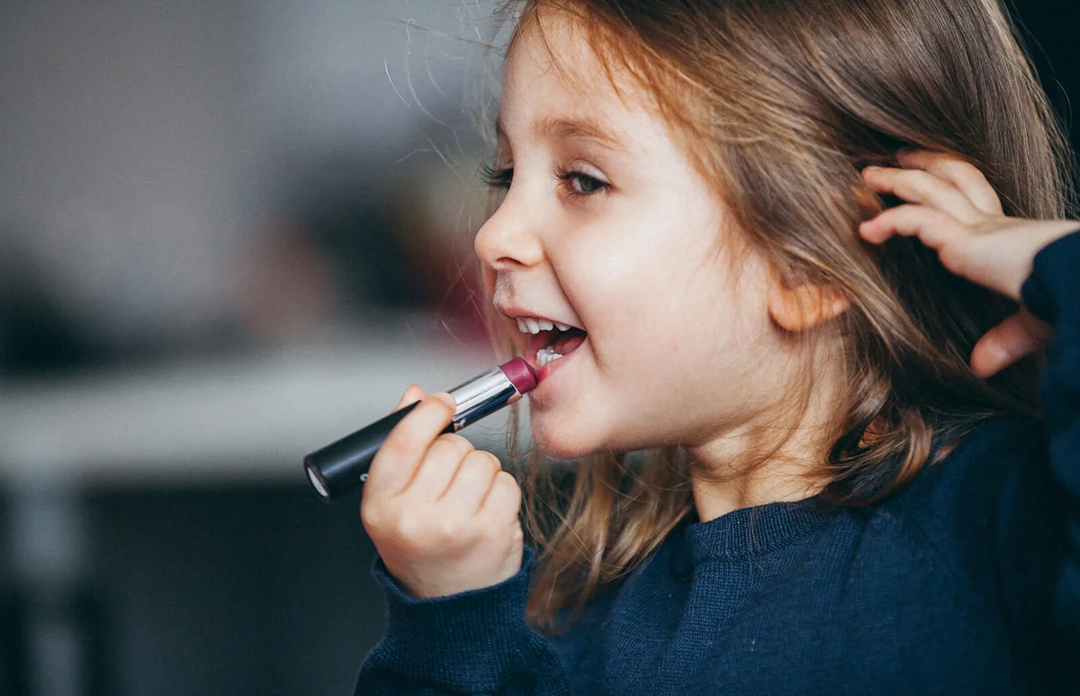Little girl's first lipstick