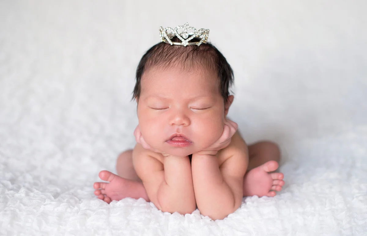 Newborn Baby Girl Wearing a Rhinestone Princess Crown