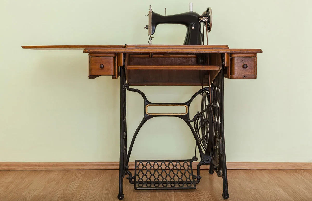 Sewing Machine On Hardwood Floor Against Wall
