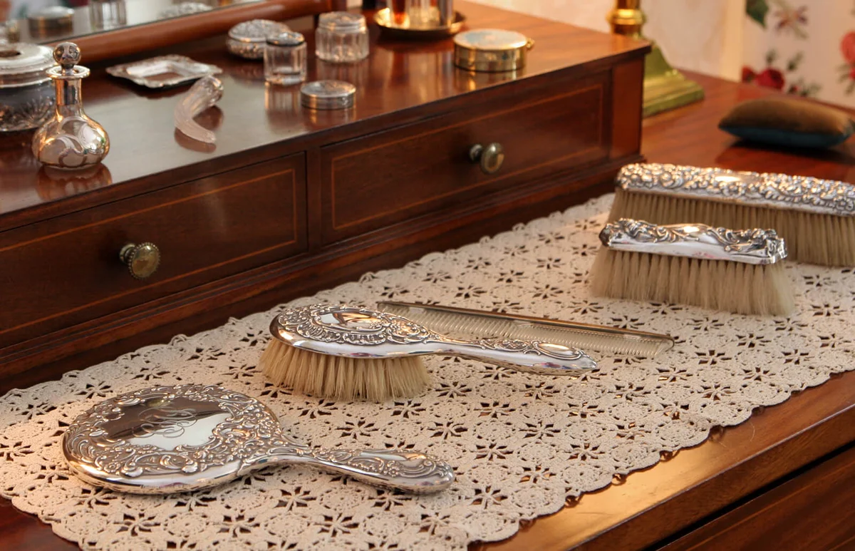 beauty products on antique dressing table