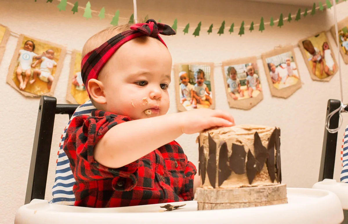 A one year old baby girl celebrating her birthday