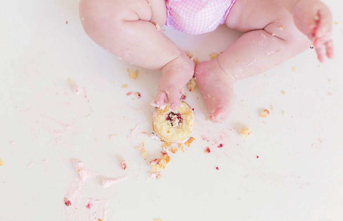Baby celebrating his first birthday with an smashcake
