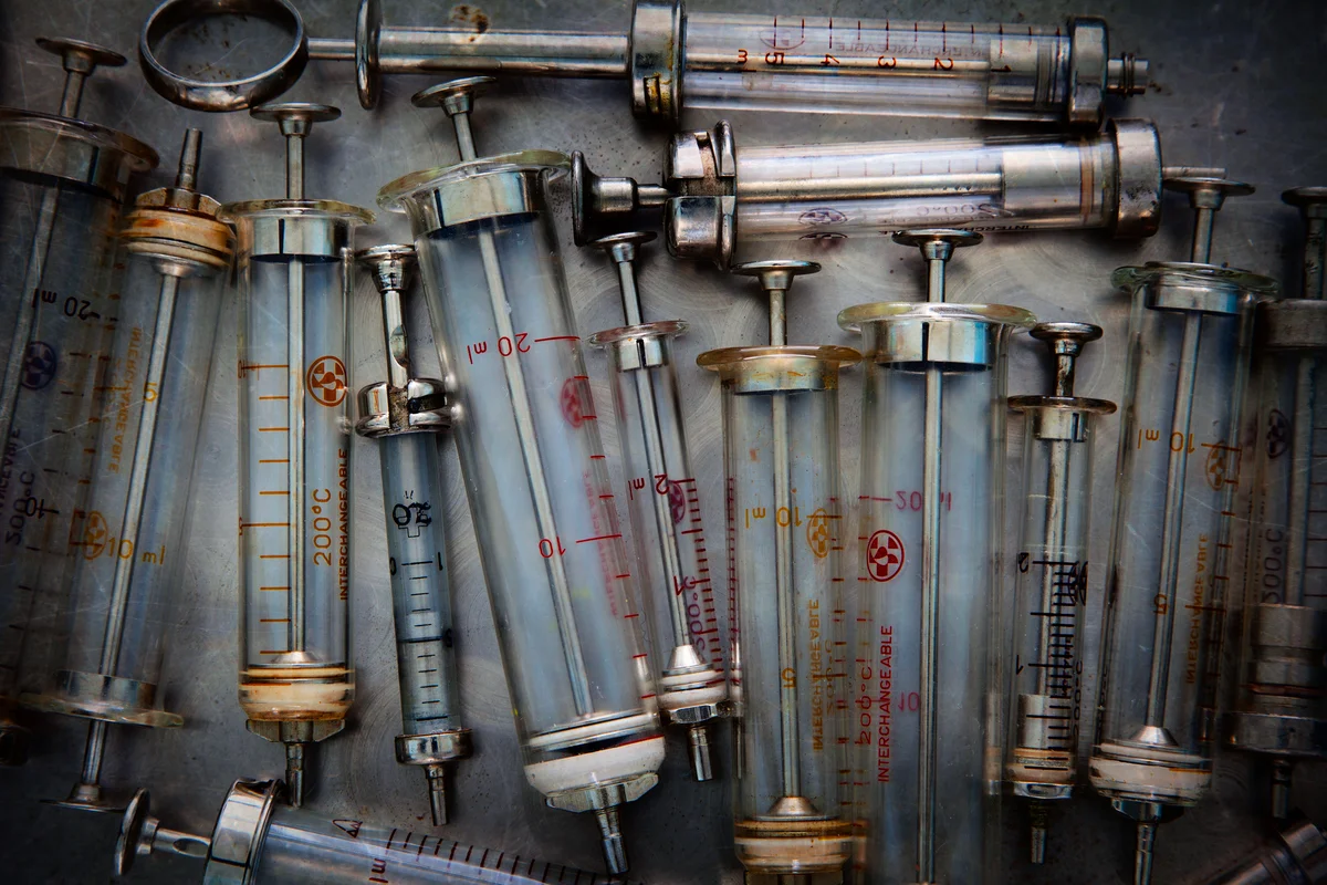 Vintage metal and glass syringes