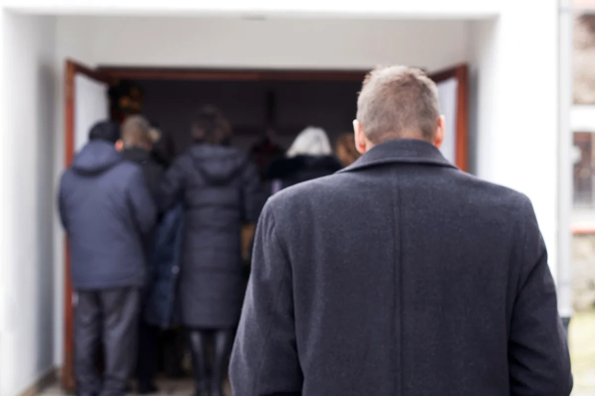People entering a funeral home