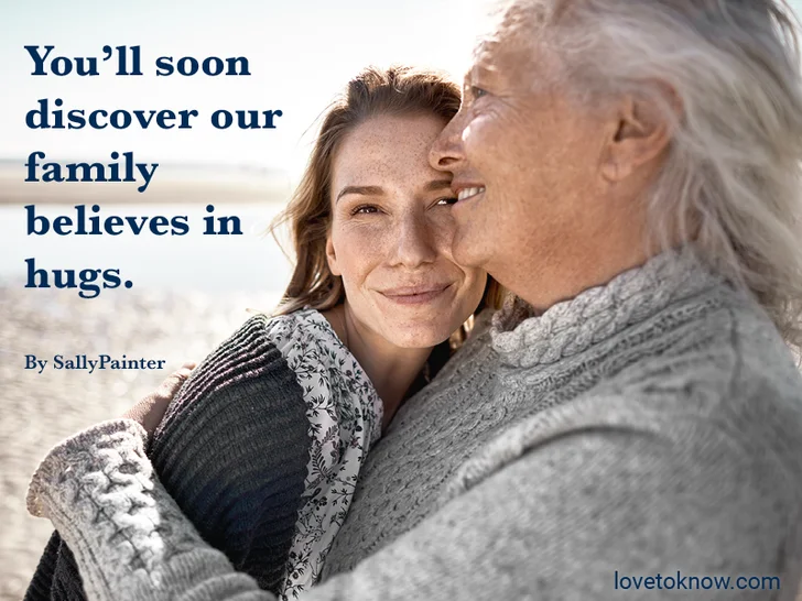 Young and older woman hugging and a welcome to the family quote