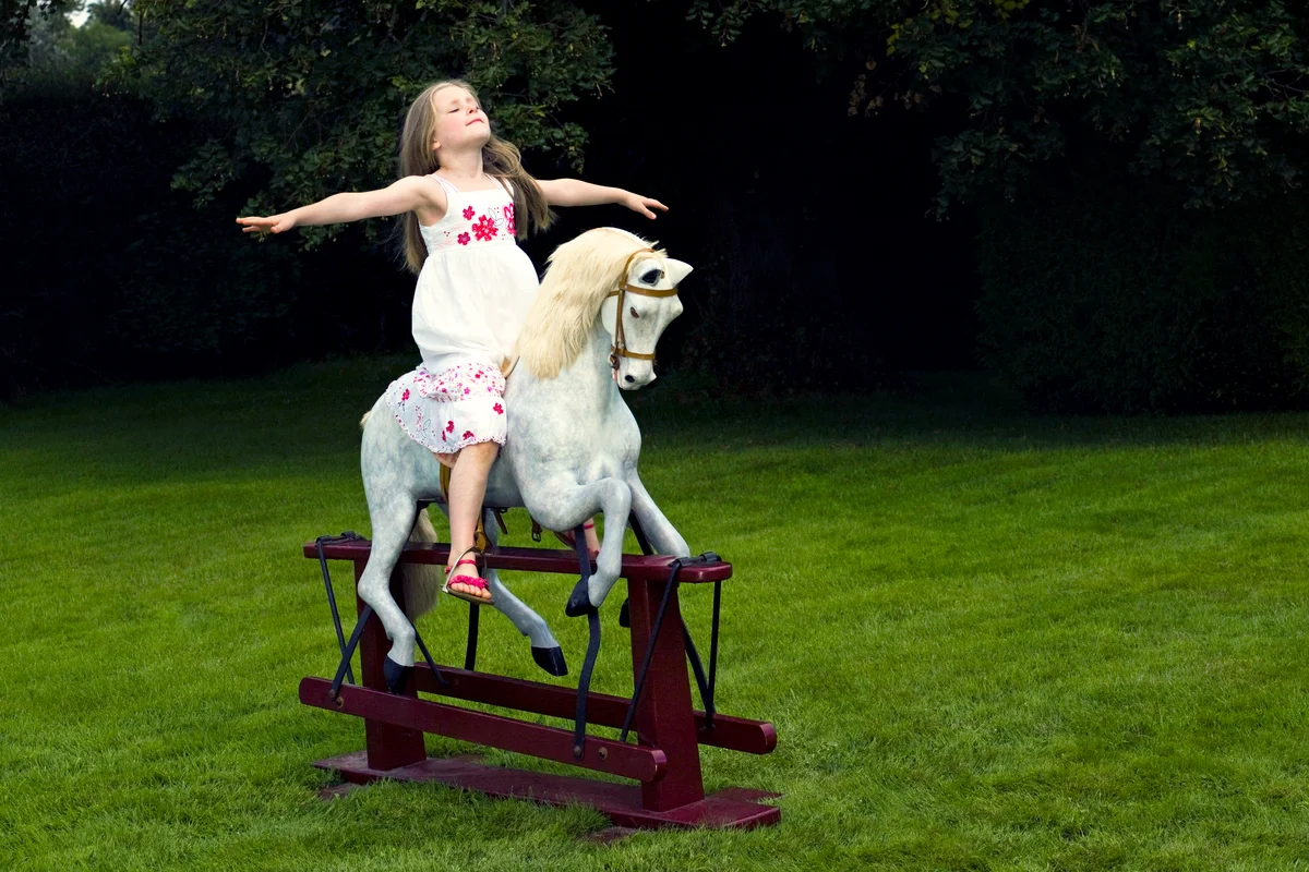 Girl on a rocking horse