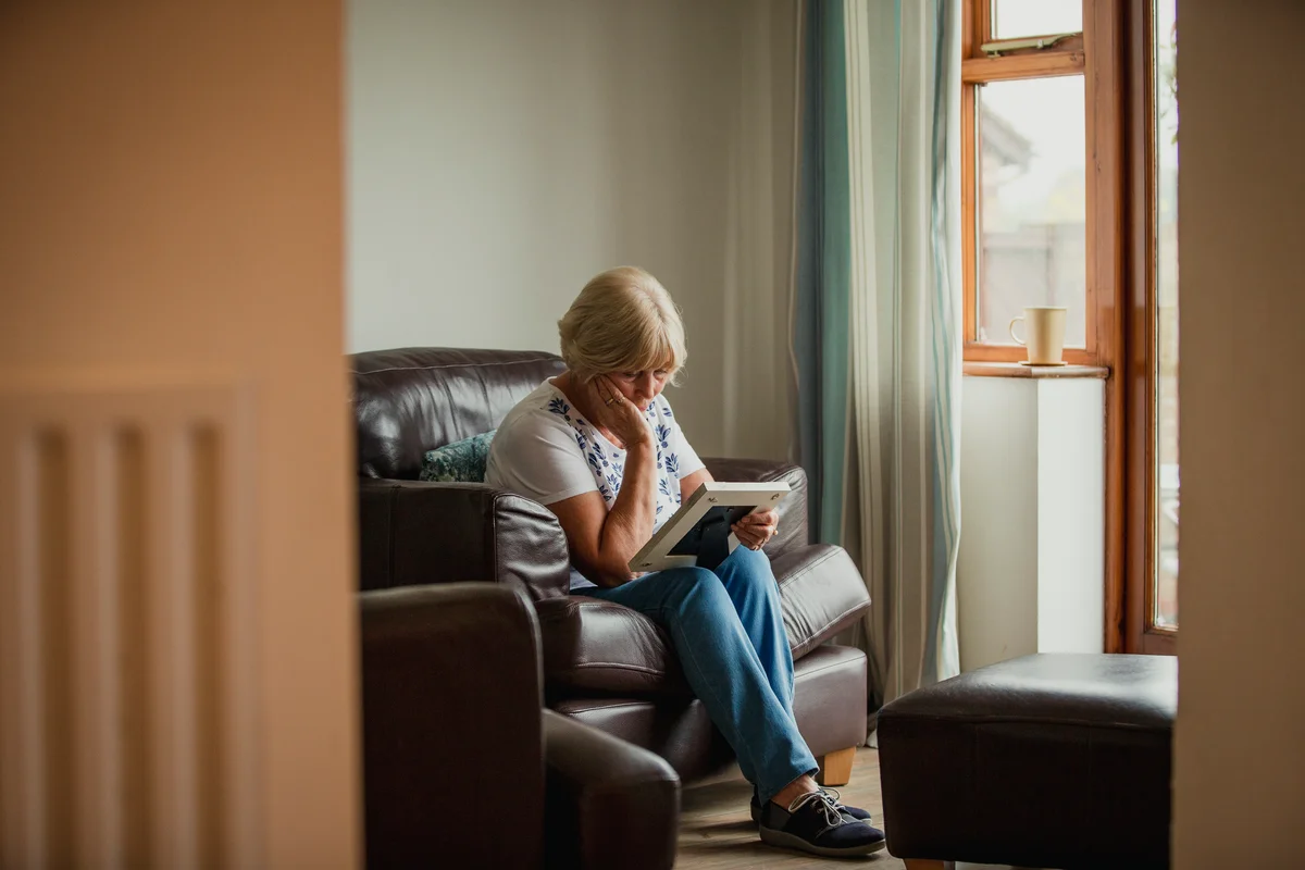 Grieving woman looking at a photo