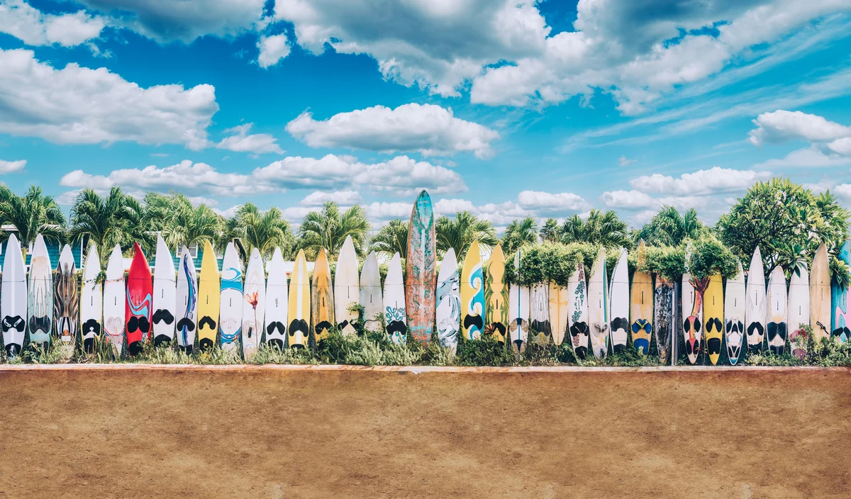 Retro Version old surfboards lined up in Hippie Town in Hawaii
