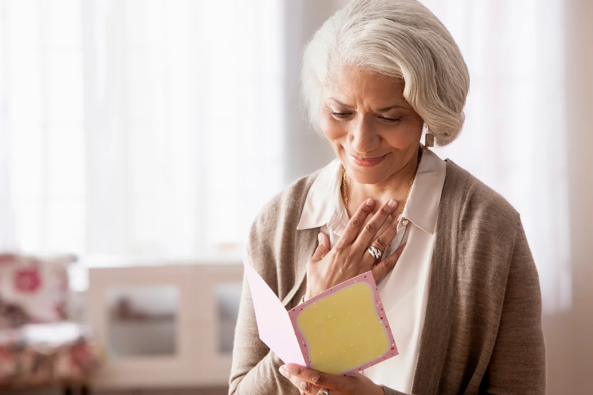 Woman reading card