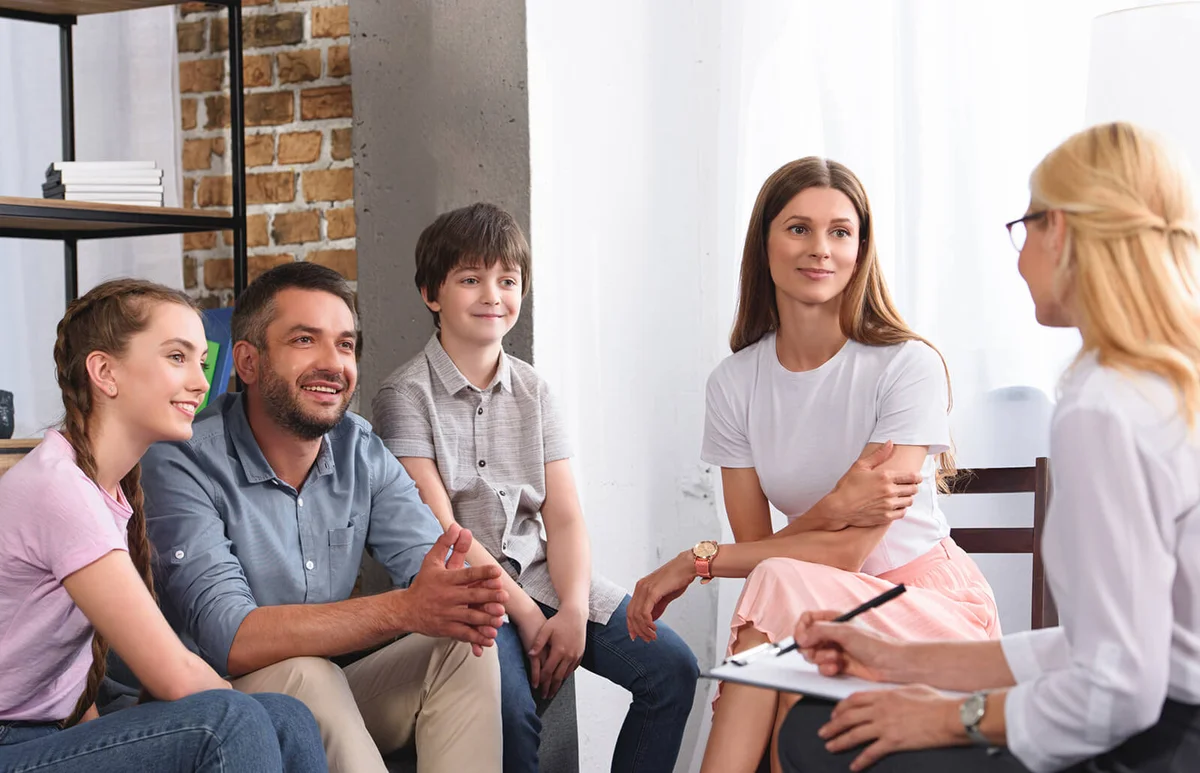 happy family sitting on therapy session