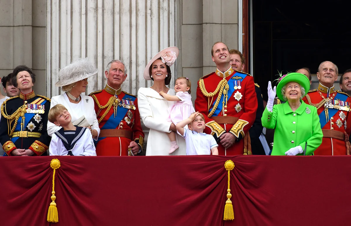 Anne, Princess Royal, Camilla, Duchess of Cornwall, Charles, Prince of Wales, Catherine, Duchess of Cambridge, Princess Charlotte of Cambridge, Prince George of Cambridge, Prince William, Duke of Cambridge, Prince Harry, Queen Elizabeth II and Prince Philip, Duke of Edinburgh watch a fly past during the Trooping the Colour, this year marking the Queen's 90th birthday at The Mall on June 11, 2016 in London, England | Getty Editorial Use