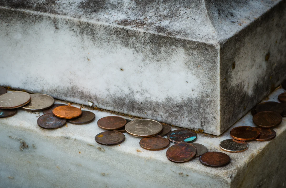Coins left on a tombstone