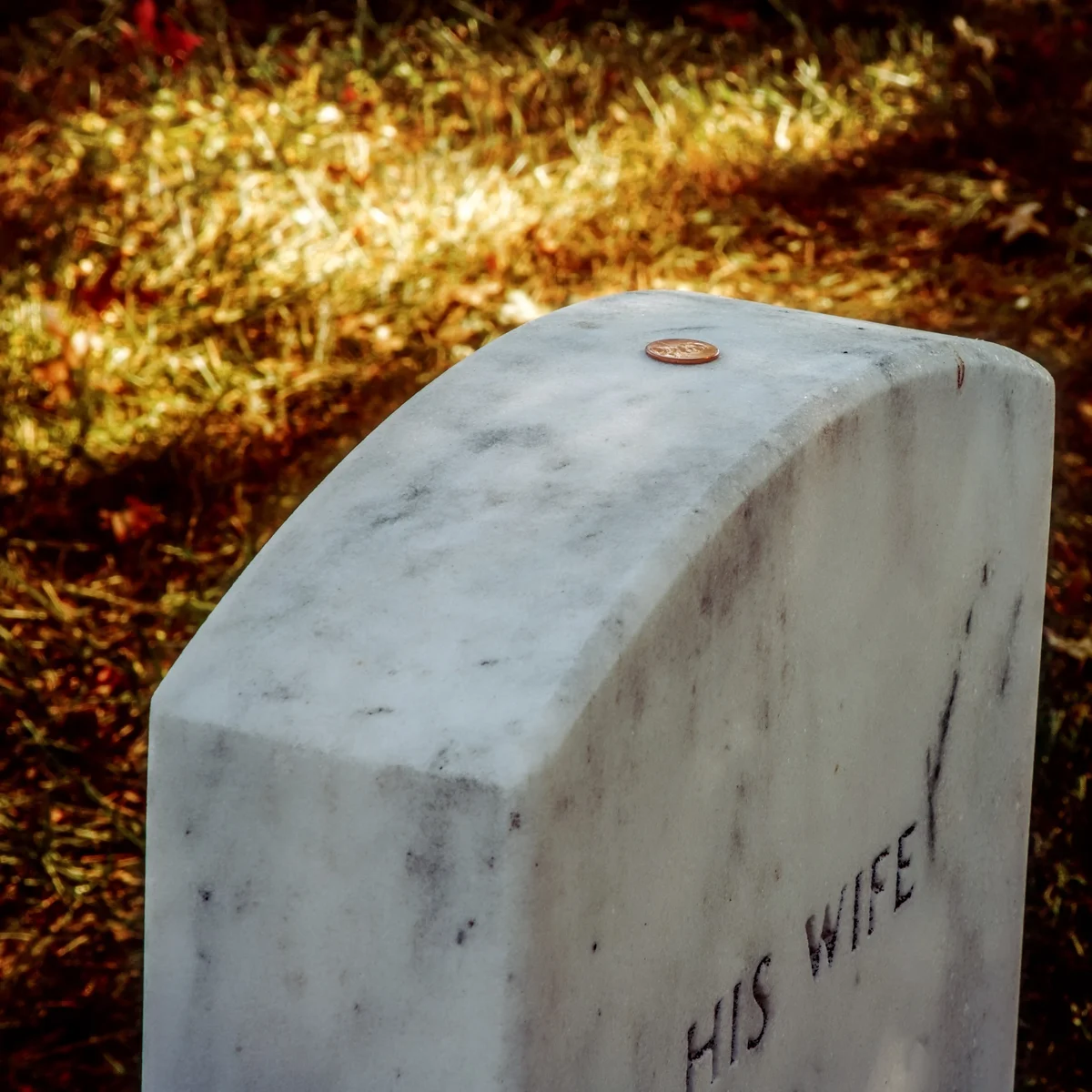 Con left on gravestone