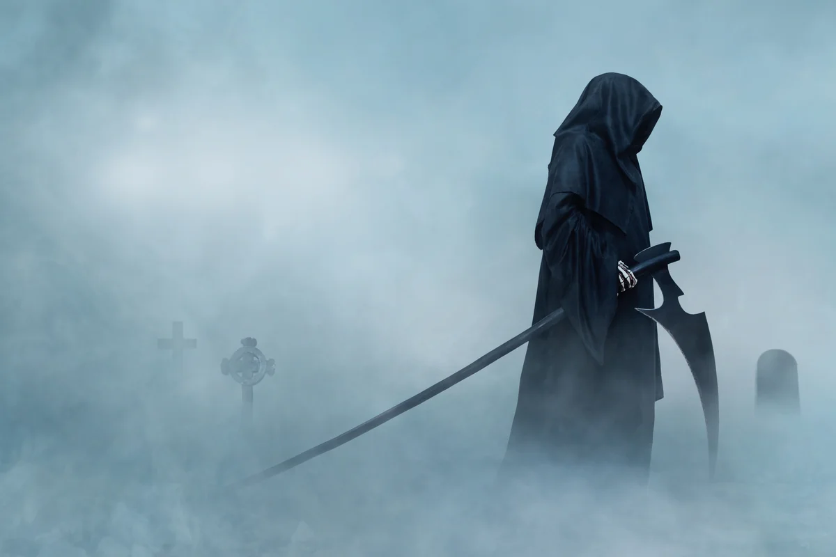 Grim reaper in a cemetery