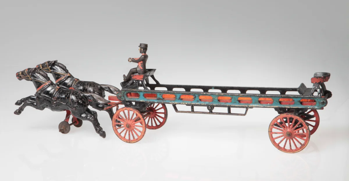 Cast iron toy hook and ladder wagon