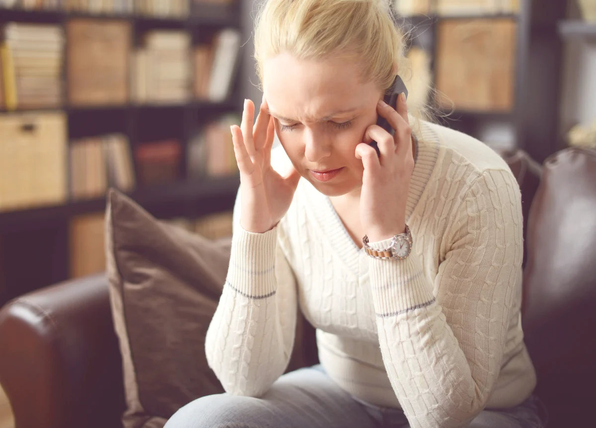 Sad woman on phone call