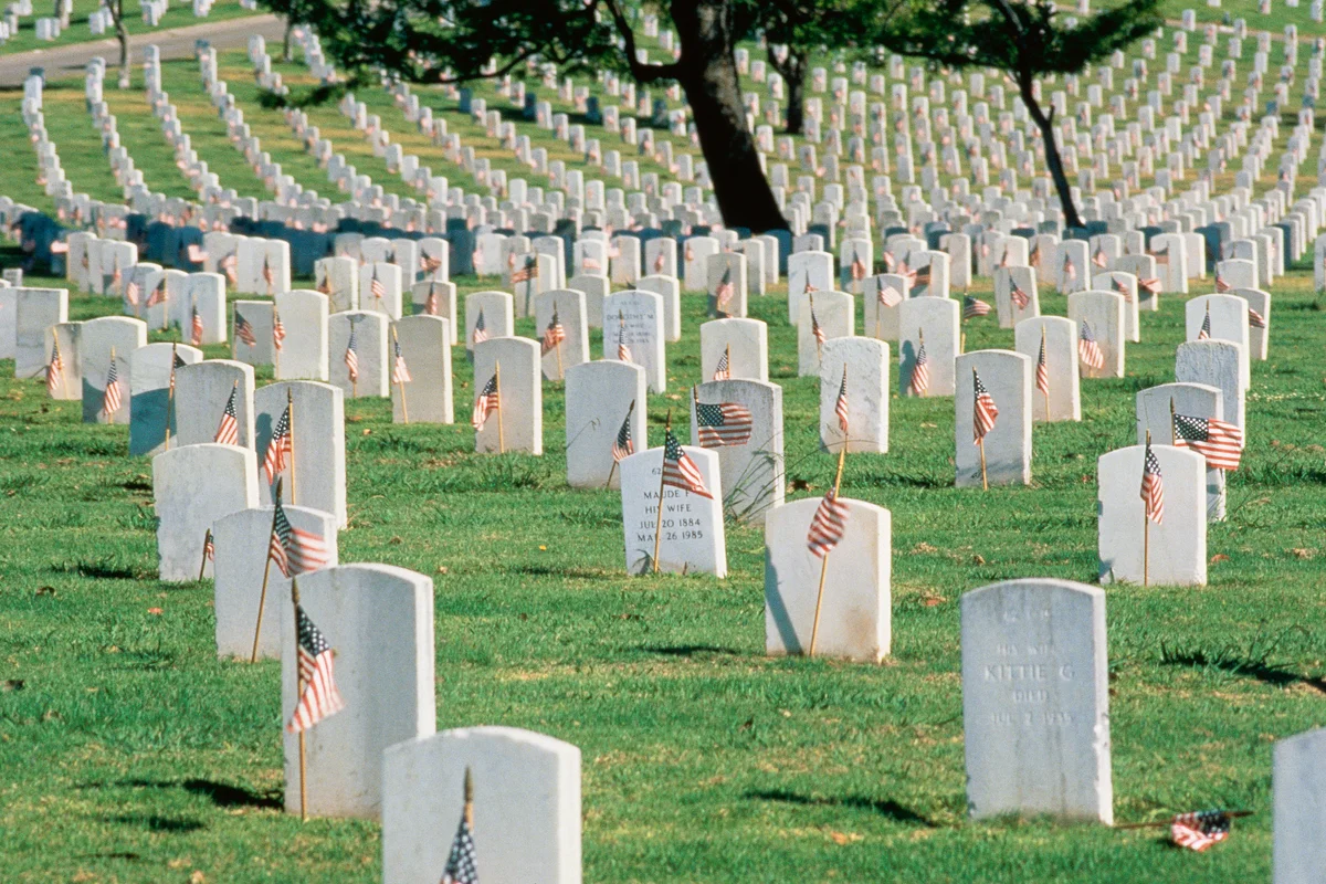 Tombstones with American flags at Arlington National Cemetery