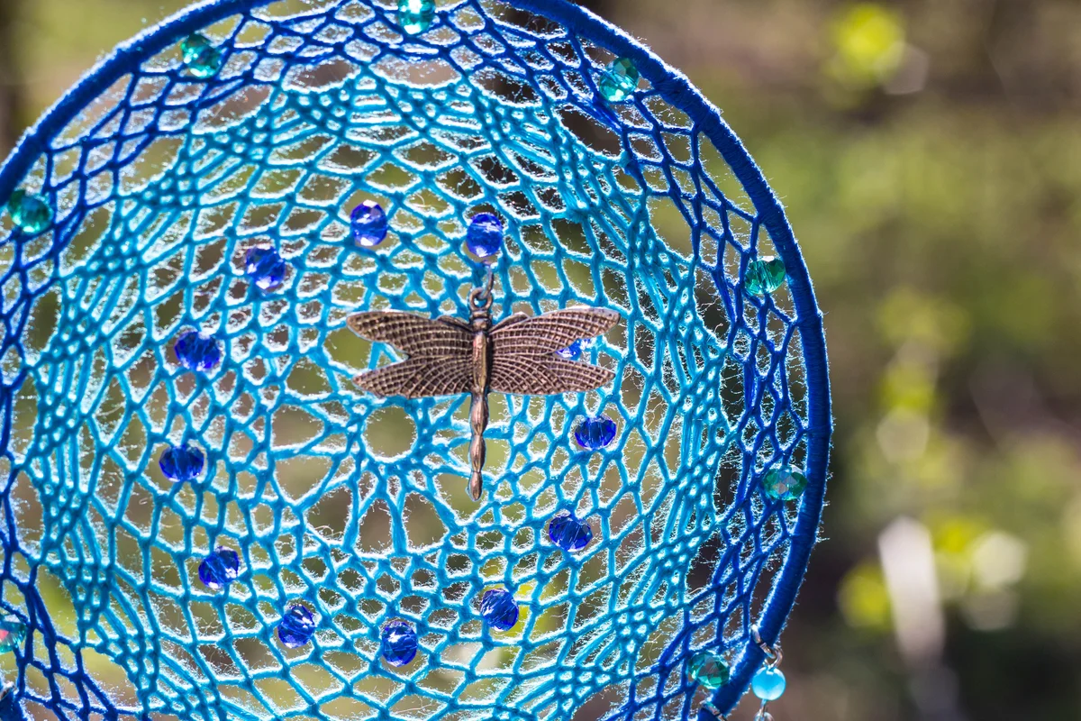 Blue dreamcatcher with dragonfly