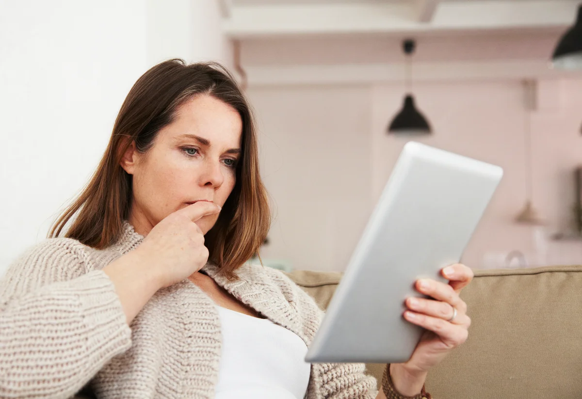 Woman reading from tablet