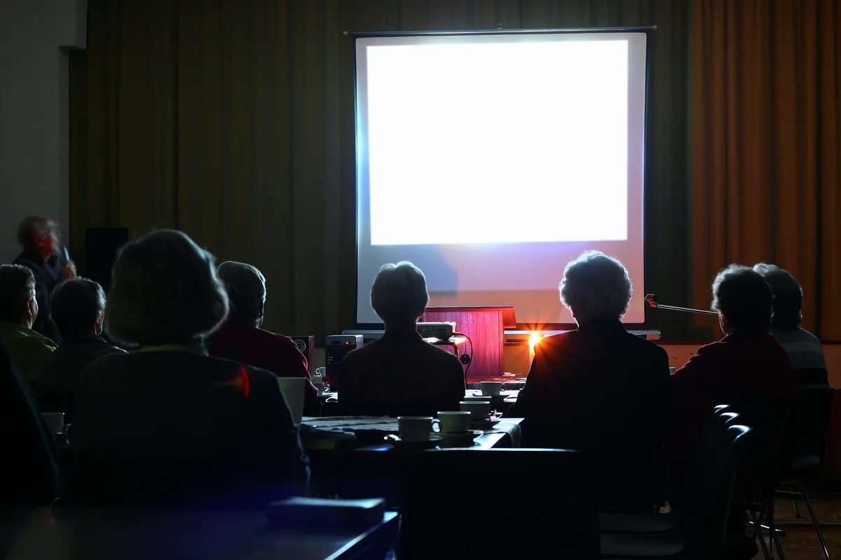 People looking at an evening presentation