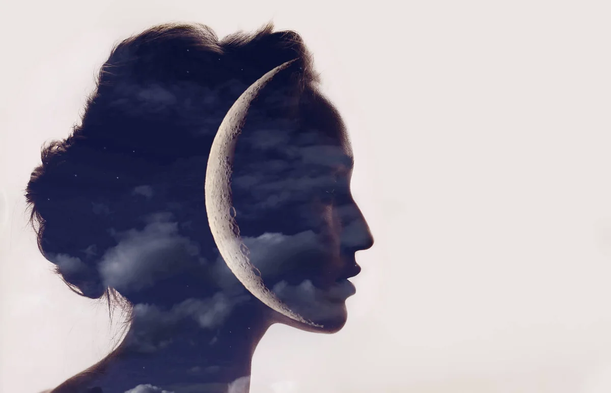 Beautiful woman profile silhouette portrait with moon in head