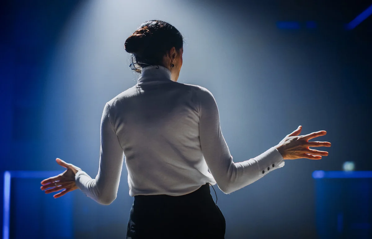 Successful Female Motivational Speaker on Stage