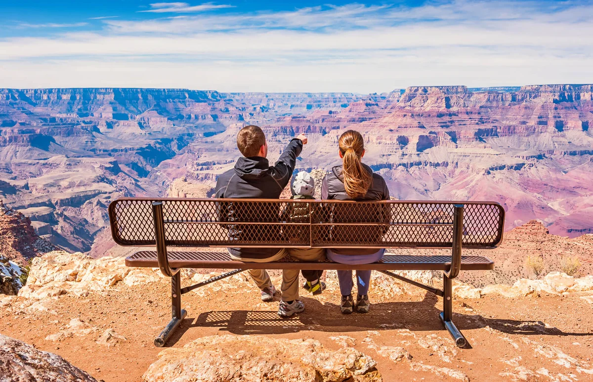 Family looking at view Grand Canyon National Park USA