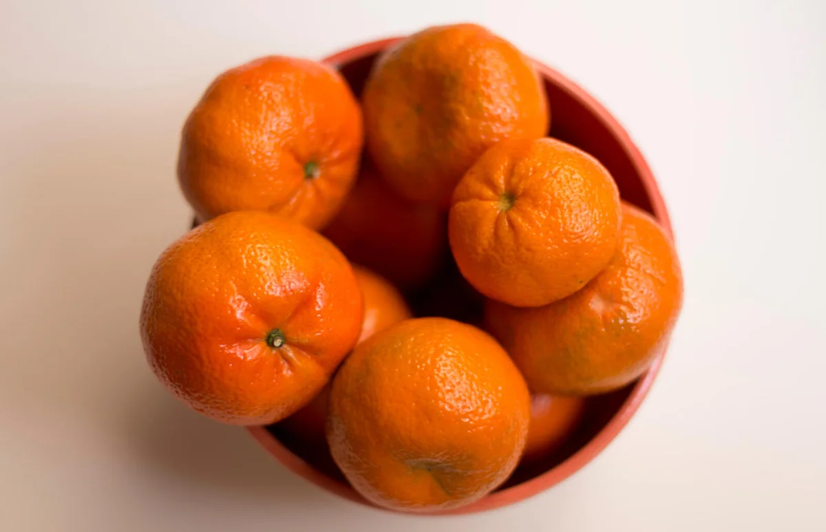 Close-Up Of Tangerines Over White Background