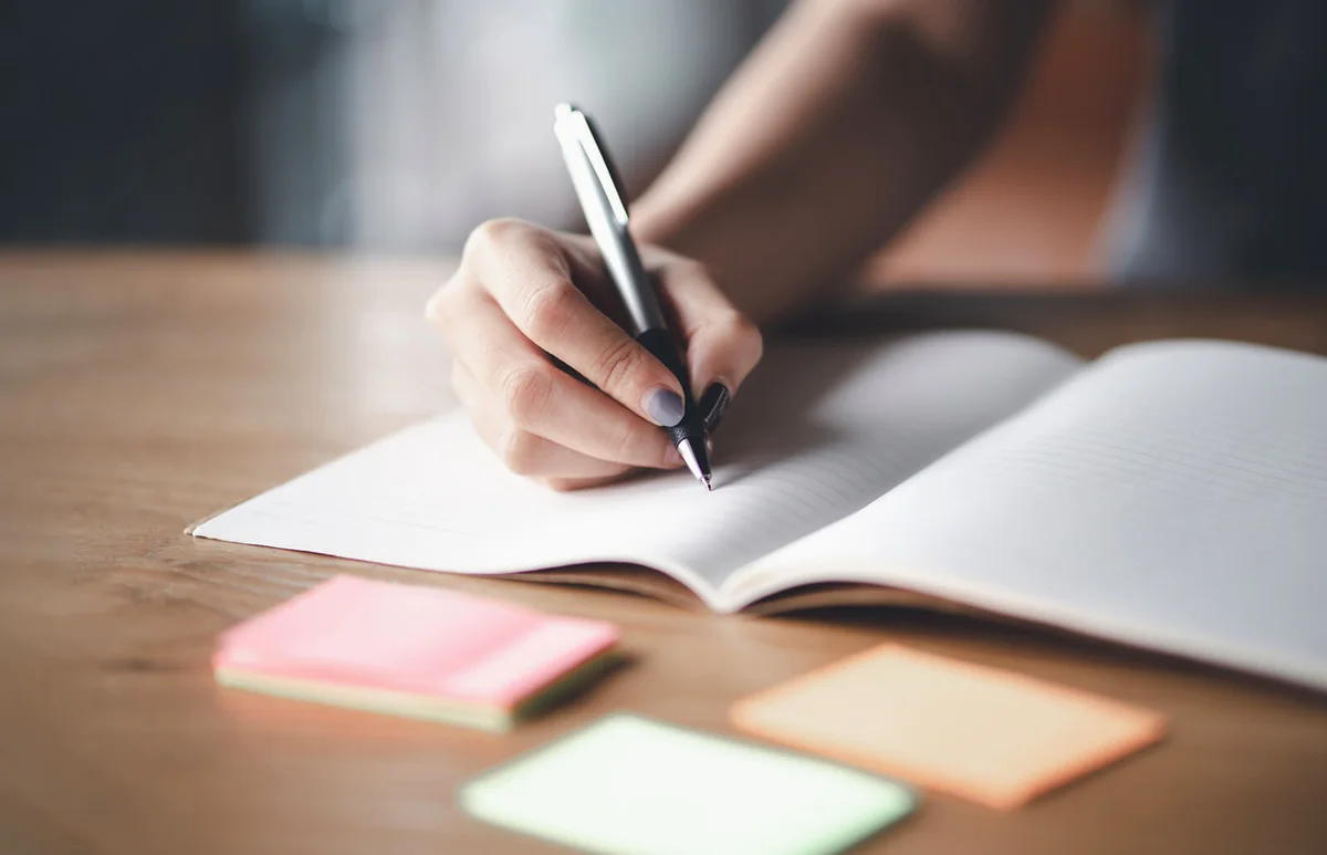 Woman writing in her journal